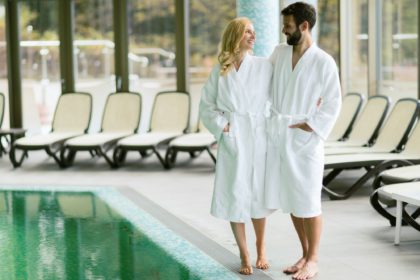 Happy couple relaxing at wellness spa center