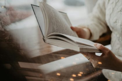 girl reading a book / holding a book