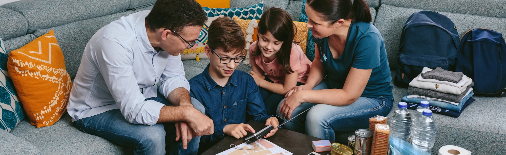 Parents explaining to their children how to use the radio in an