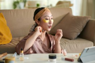 Young Woman Blowing on Nails